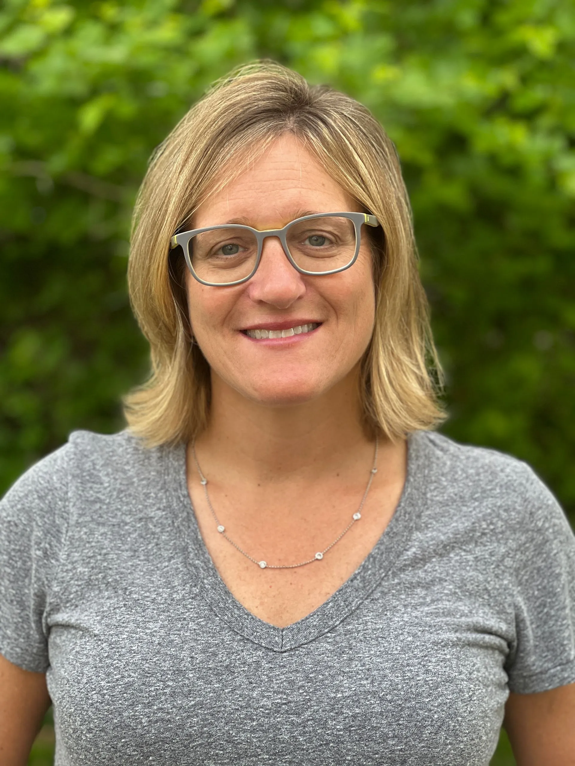 A headshot of Marcee Senker, co-owner of A-AAA Tree Service.